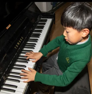 boy playing piano